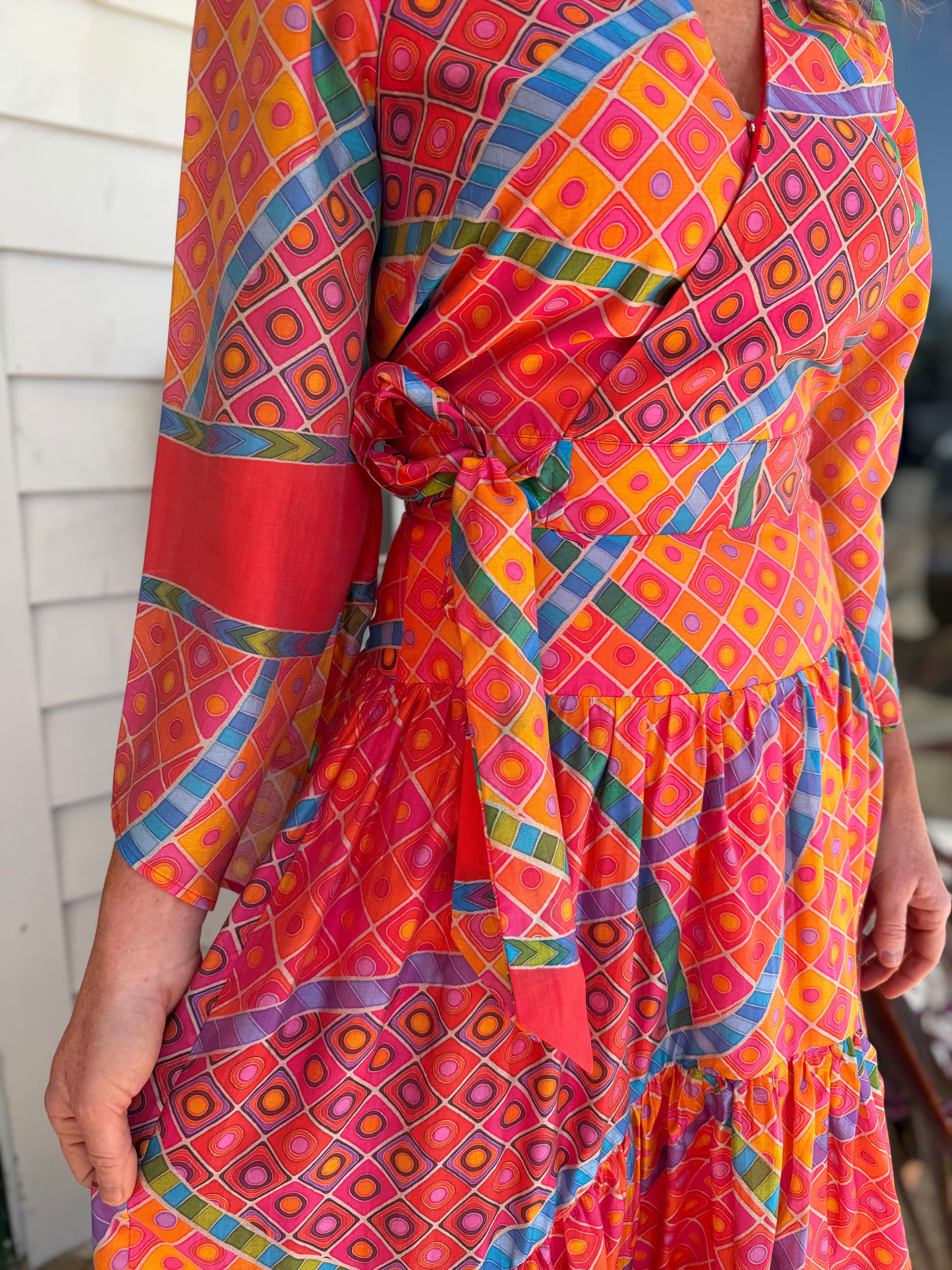 RED MULTI GEO PRINT FAUX WRAP SHEEVA TOP