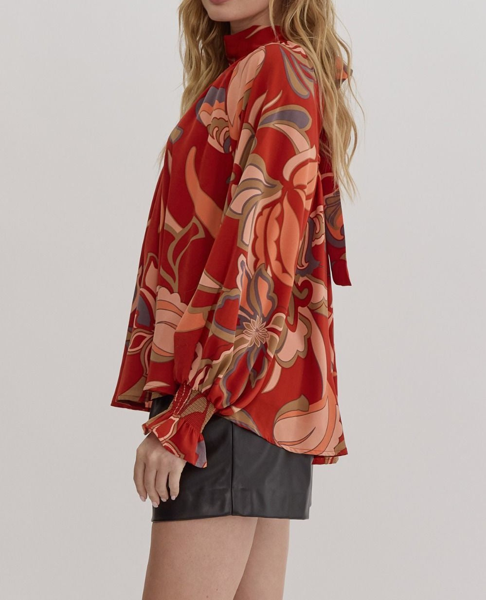 RUST PRINTED MOCK/TIE NECK FLOWY SLEEVE BLOUSE