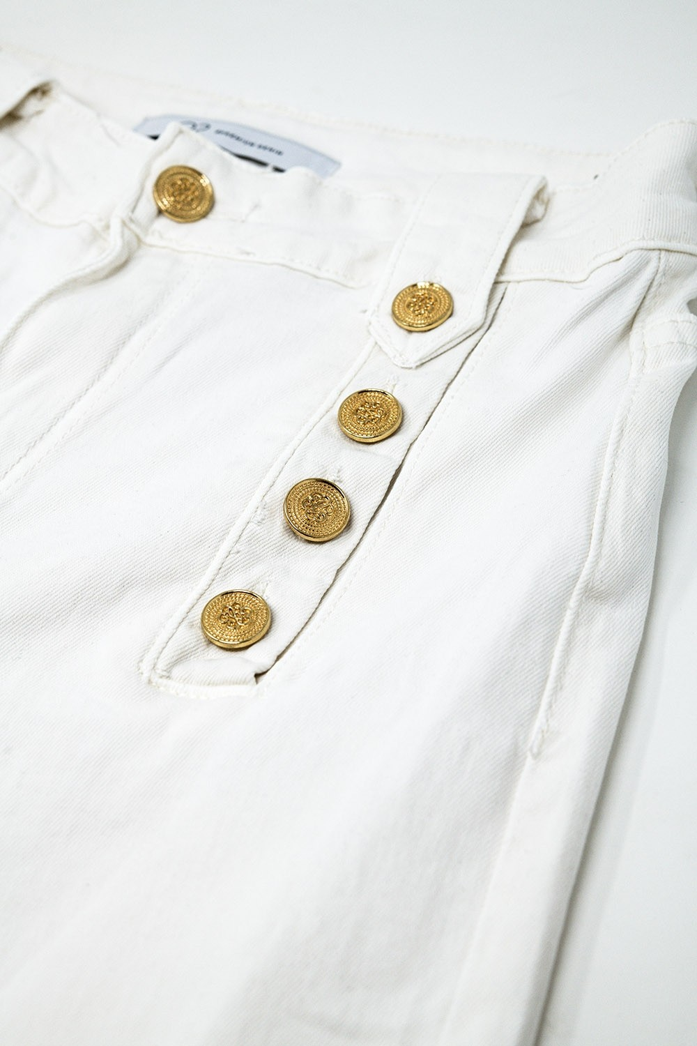 CREAM STRAIGHT JEANS WITH GOLD BUTTON ACCENT