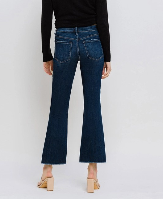 PRIVILEGE DARK WASH MID RISE RAW HEM KICK FLARE JEANS