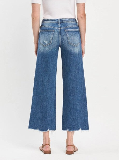 MEDIUM WASH MESMERIZES MID RISE RAW HEM WIDE LEG JEANS